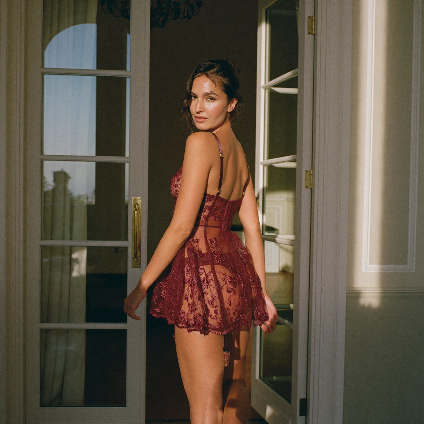 Oxblood embroidered babydoll beside French doors